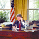 As shit continues to pile up on his desk, President Clinton phones
members of Congress to rally support for his proposed National Week Off.